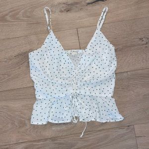 Patterned white tank top/crop top with green star pattern, size XS